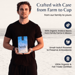 Will, co-founder of Seek® Mold-Free Coffee, holding a bag of coffee on the beach, highlighting 100% organic Arabica beans, small-batch roasting, and USDA Organic & Fair Trade certifications.