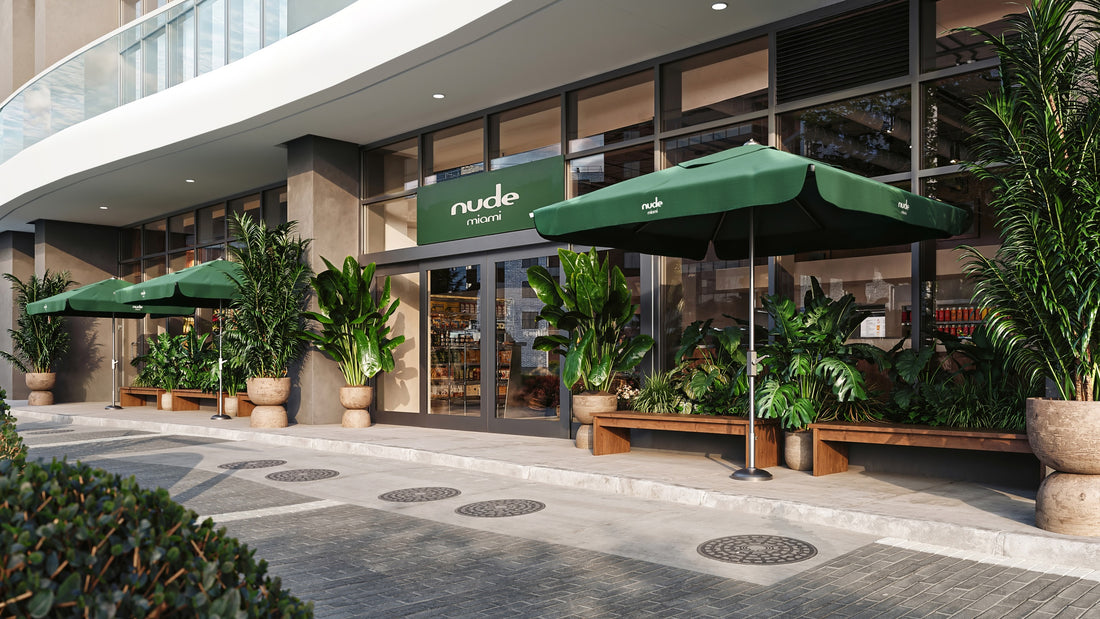 Grocery healthy building entrance with green umbrellas and potted plants